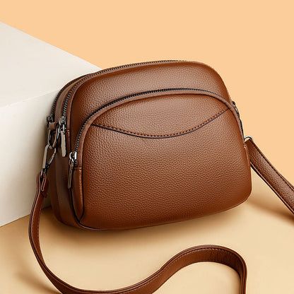 Bolso pequeño de cuero con forma de arco