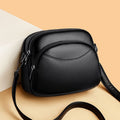 Bolso pequeño de cuero con forma de arco