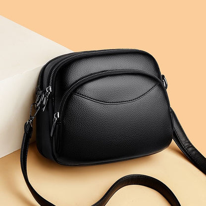 Bolso pequeño de cuero con forma de arco