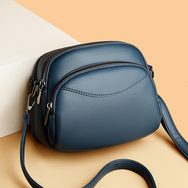 Bolso pequeño de cuero con forma de arco